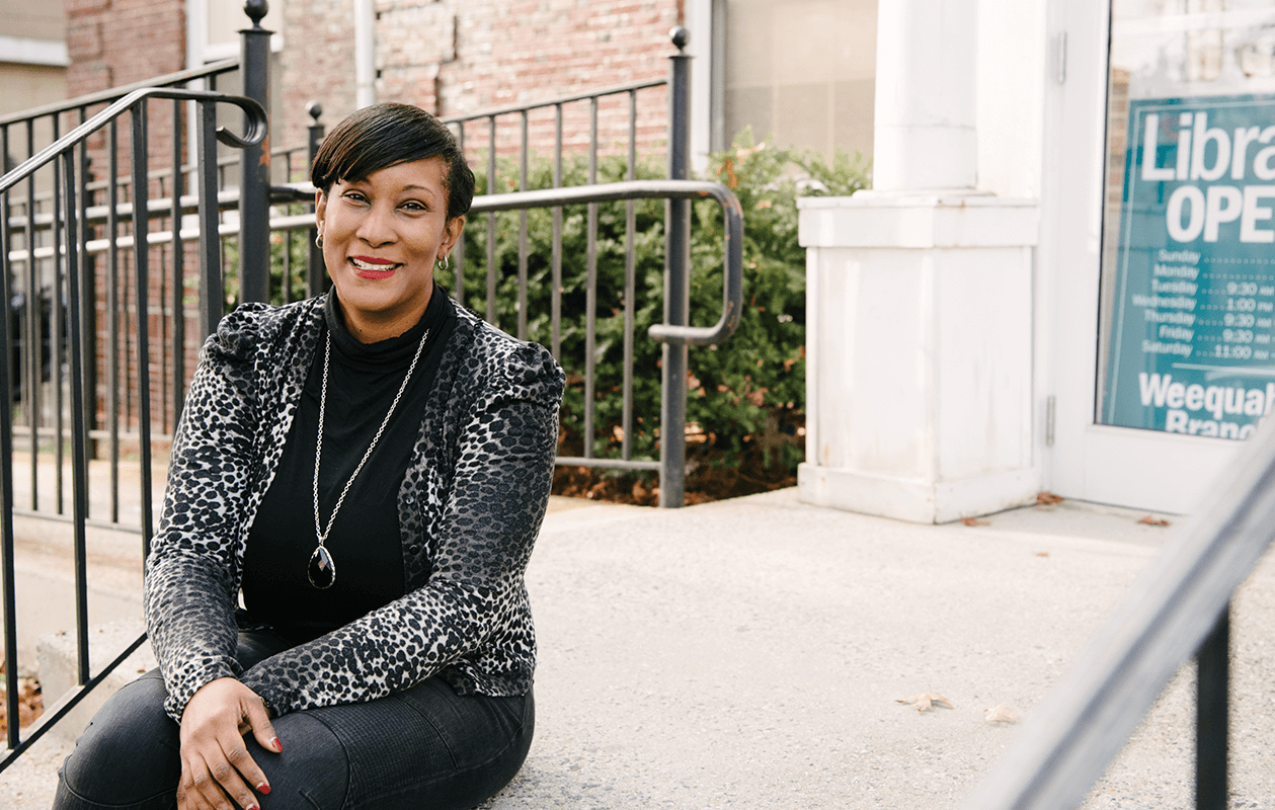 Woman sitting on library steps